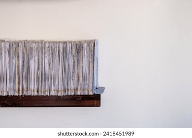 stack of files CD and books on shelf with white background