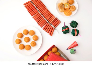 Stack Of Fire Crackers With Sweets For Diwali Celebration 