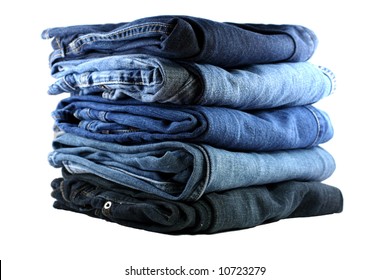 stack of five various shades of blue jeans on a white background - Powered by Shutterstock