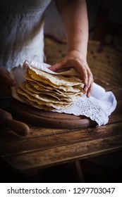 Stack flatbread naan bread in hand chef cooking tortilla flatbread 