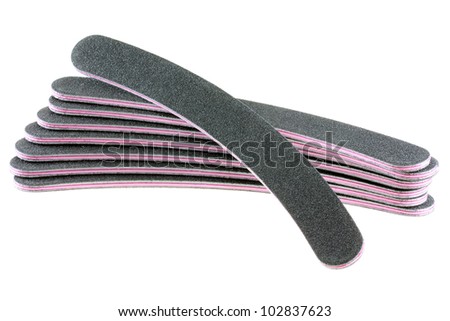 A stack of flexible Emery board used in manicures and pedicures - Nail Files in black and pink color, beauty product isolated on white background