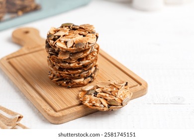 A stack of Florentine cookies. Eid al-Fitr cookies. Made from sugar and various nuts and seeds. Perfect for recipe, article, catalogue, or any commercial purposes.