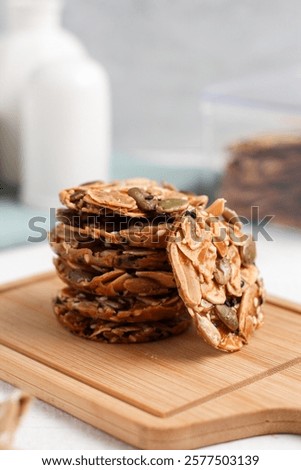 A stack of Florentine cookies. Eid al-Fitr cookies. Made from sugar and various nuts and seeds. Perfect for recipe, article, catalogue, or any commercial purposes.