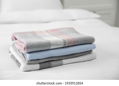 stack clothes on bed