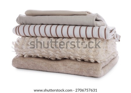 Stack of folded clothes isolated on white
