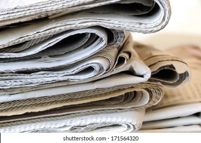 stack of folded newspapers