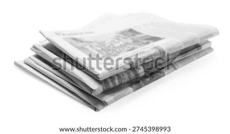 Stack of folded newspapers isolated on white