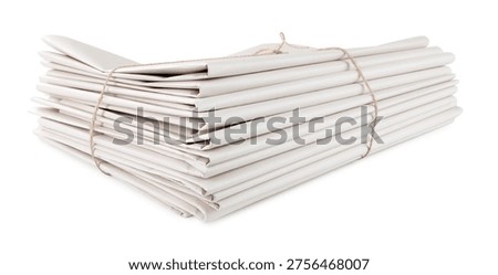 Stack of folded newspapers isolated on white