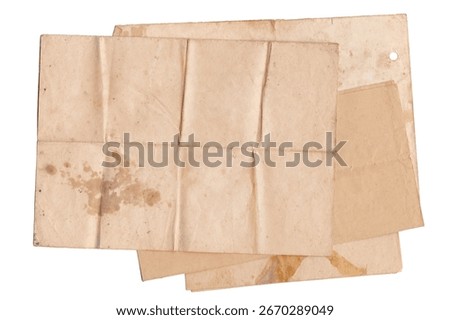 Stack of Folded Old Papers on White Background. Brown stained folded parchment vintage paper sheet with space for text. Aged papers sheets pile, top view