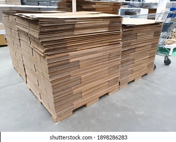Stack of folded paper box in warehouse or hardware store