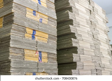 Stack of folded paper box in warehouse