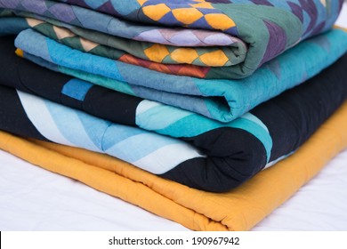 Stack Of Folded Quilts 