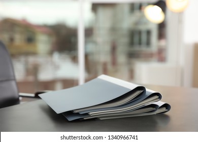 Stack of folders with documents on office table. Space for text