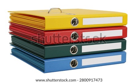 Stack of four colorful ring binders with metal mechanisms and label holders