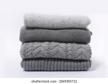 Stack Of Four Gray Folded Knitted Sweaters