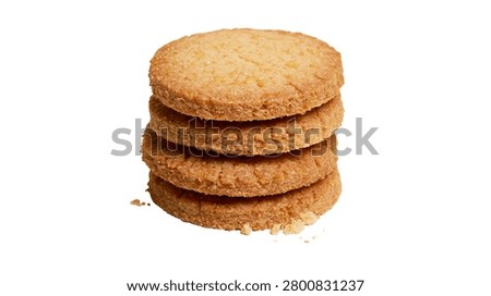 Stack of four round golden brown buttery shortbread biscuits