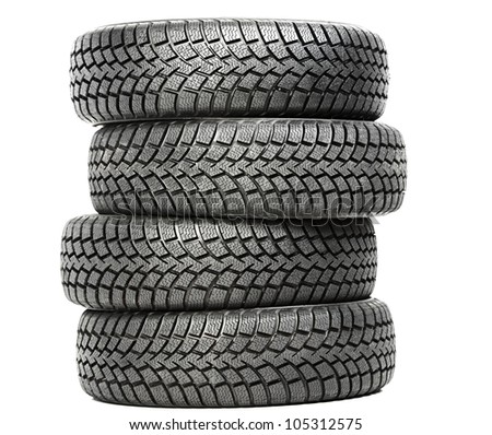 Stack of four wheel new black tyres for winter car driving isolated on white background