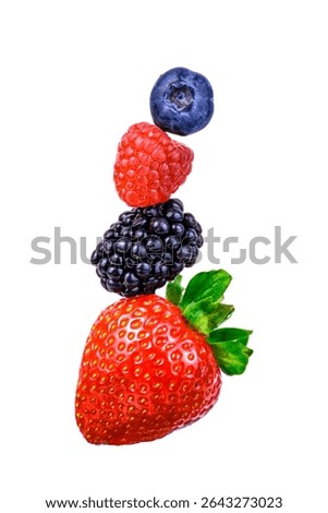 Stack of fresh berries isolated on white background: strawberry, blackberry, raspberry, and blueberry