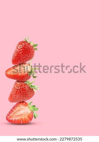 Stack of fresh strawberries on pink background, space for text