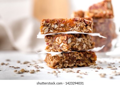 stack of fruit and nut bars, useful components, close up, for healthy concept. Light background - Powered by Shutterstock