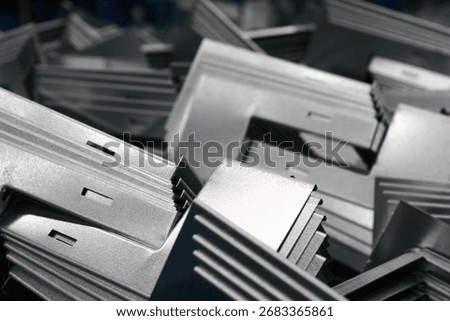 Stack of galvanized angle steel brackets, angle iron