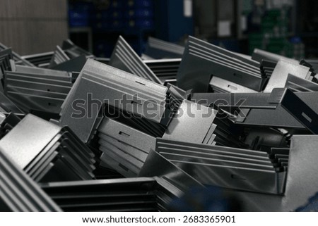 Stack of galvanized angle steel brackets, angle iron