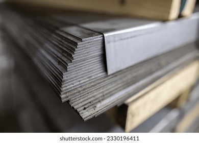 a stack of galvanized thick hot rolled steel sheets in a warehouse