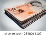 A stack of GBP British sterling pound bills