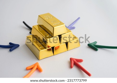 Stack gold bars and arrow around on white background. Gold price increase rising in commodity trading bull market investment concept. Gold is store of value in recession crisis and popular investment.