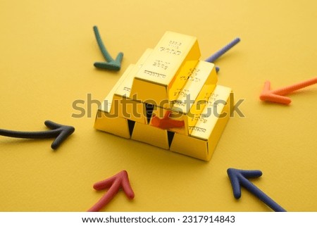 Stack gold bars and arrow around on yellow background. Gold price increase rising in commodity trading bull market investment concept. Gold is store of value in recession crisis and popular investment