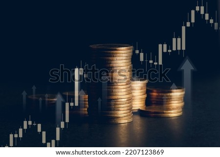 Stack of Gold Coin  with Arrow visual graphic and candle stick graph. Fussiness Concept : Market uptrend. COPY SPACE.