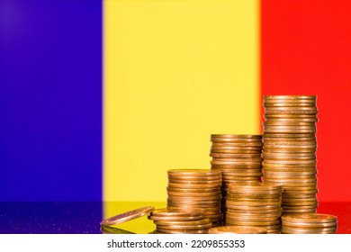 A stack of gold coins on the background of the flag of 
Romania. Country economy concept - Powered by Shutterstock