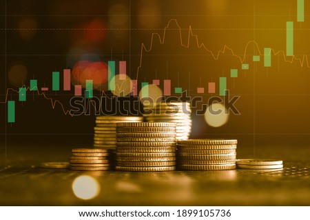 Stack of gold money coin with trading graph, financial investment concept can be use as background