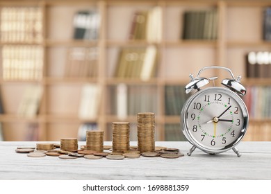 Stack Golden Coins With Alarm Clock, Save  Time Money Concept