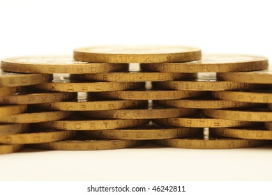 Stack of golden coins isolated on white background