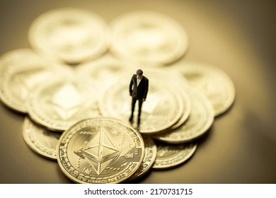 Stack Of Golden Ether Coins Or Ethereum Coins Close Up On Golden Background Depicting Cryptocurrency And Digital Money