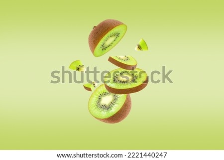 Stack of green kiwi falling or flying.Creative levitation food