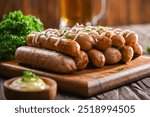 A stack of grilled sausages drizzled with creamy mayonnaise, garnished with fresh parsley. The juicy sausages are arranged beautifully on a wooden board, showcasing their smoky flavo