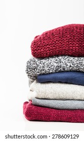 Stack Of Handmade Wool Sweaters Isolated