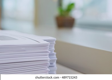 Stack of handout organized for conference on desk at office. - Shutterstock ID 489715243