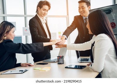 Stack of hands symbolizing trust and cooperation, Group of professional business people are working and brainstorming discussed about work in conference room.
