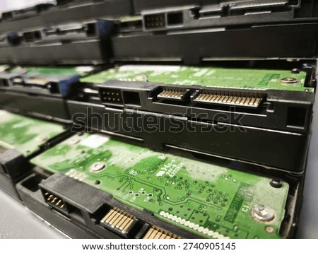 Stack of Hard Disk Drives with Visible Circuit Boards – Data Storage, Server Infrastructure and Cybersecurity Concept