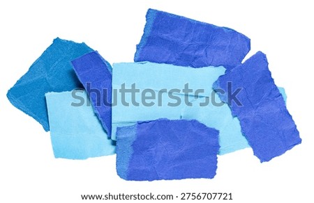 Stack or heap of blue crumpled scraps, stripes or snippets of paper or cardboard, isolated on white background