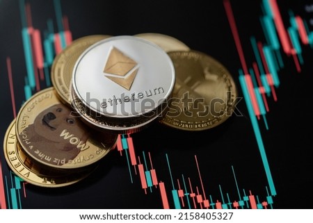 Stack or heap of gold various cryptocurrency with candle stick graph chart and digital background.