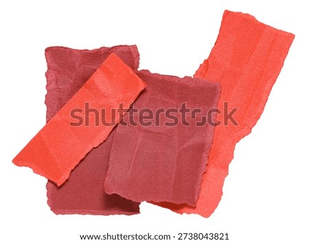 Stack or heap of red crumpled scraps, stripes or snippets of paper or cardboard, isolated on white background