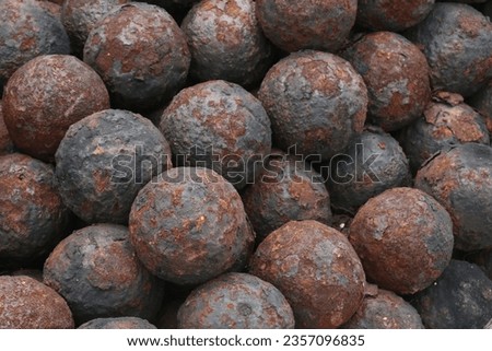 a stack of historical cannonballs 