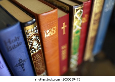 Stack Of Holy Books : Bible And Quran. Christianity And Islam. 