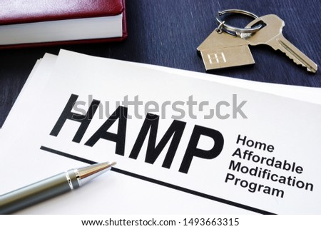 Stack of Home Affordable Modification Program HAMP documents.