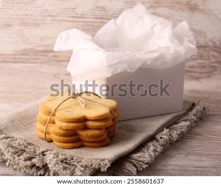 Stack of homemade cookies ready to pack for edible gift box