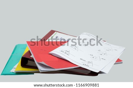 stack of homework, mathematics task, books, file, booklet and white background